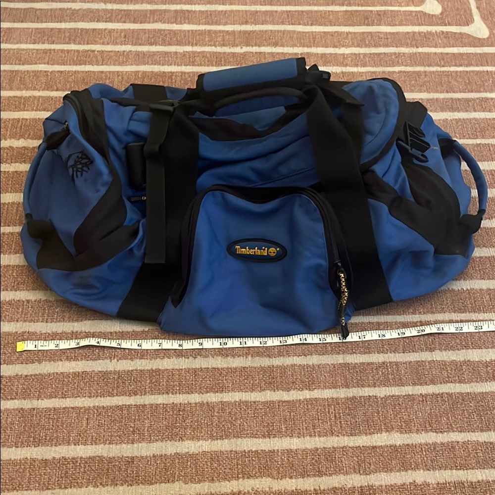Timberland Blue and Black Duffel Bag with Durable Design